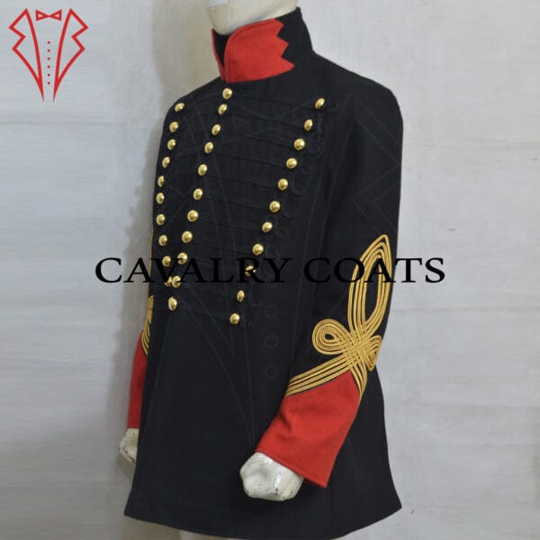 Black Dolman Husaren Jacket. This historical military garment features a high collar, adorned with gold braiding and intricate embroidery. The front of the jacket displays a series of parallel gold cords, known as frogging, fastened with decorative buttons. The cuffs and sleeves are similarly embellished with gold accents. The rich black fabric contrasts elegantly with the bright gold decorations, reflecting the ceremonial and formal nature of this uniform piece