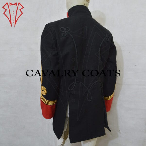 Black Dolman Husaren Jacket. This historical military garment features a high collar, adorned with gold braiding and intricate embroidery. The front of the jacket displays a series of parallel gold cords, known as frogging, fastened with decorative buttons. The cuffs and sleeves are similarly embellished with gold accents. The rich black fabric contrasts elegantly with the bright gold decorations, reflecting the ceremonial and formal nature of this uniform piece